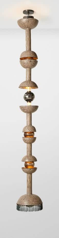 A very tall, multi-tiered pendant light featuring an elongated, segmented design. The main body is d… — 3D model