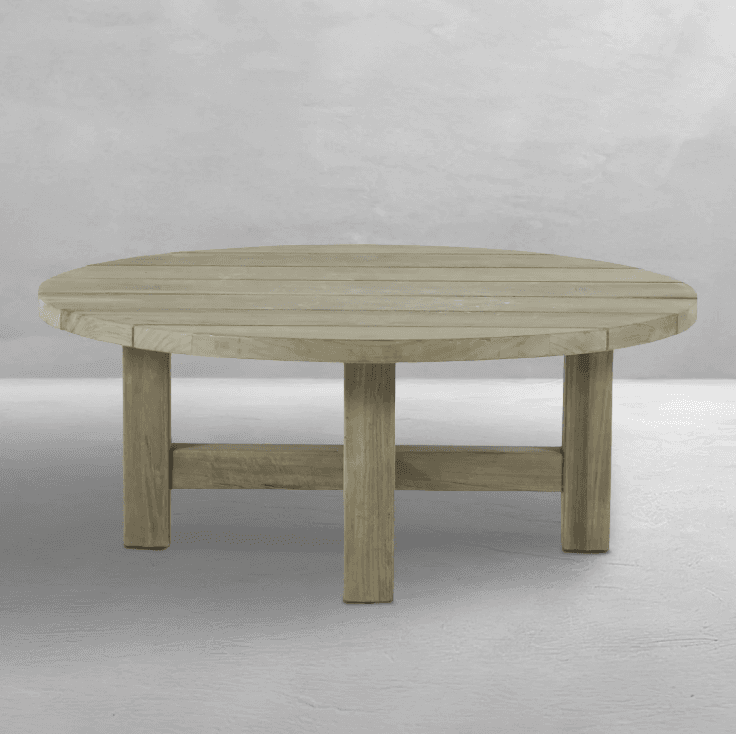 A round coffee table with a slatted top and a sturdy, minimalist base. The base consists of four legs connected by two horizontal beams. The overall design suggests outdoor use due to the material and style. — 3D model