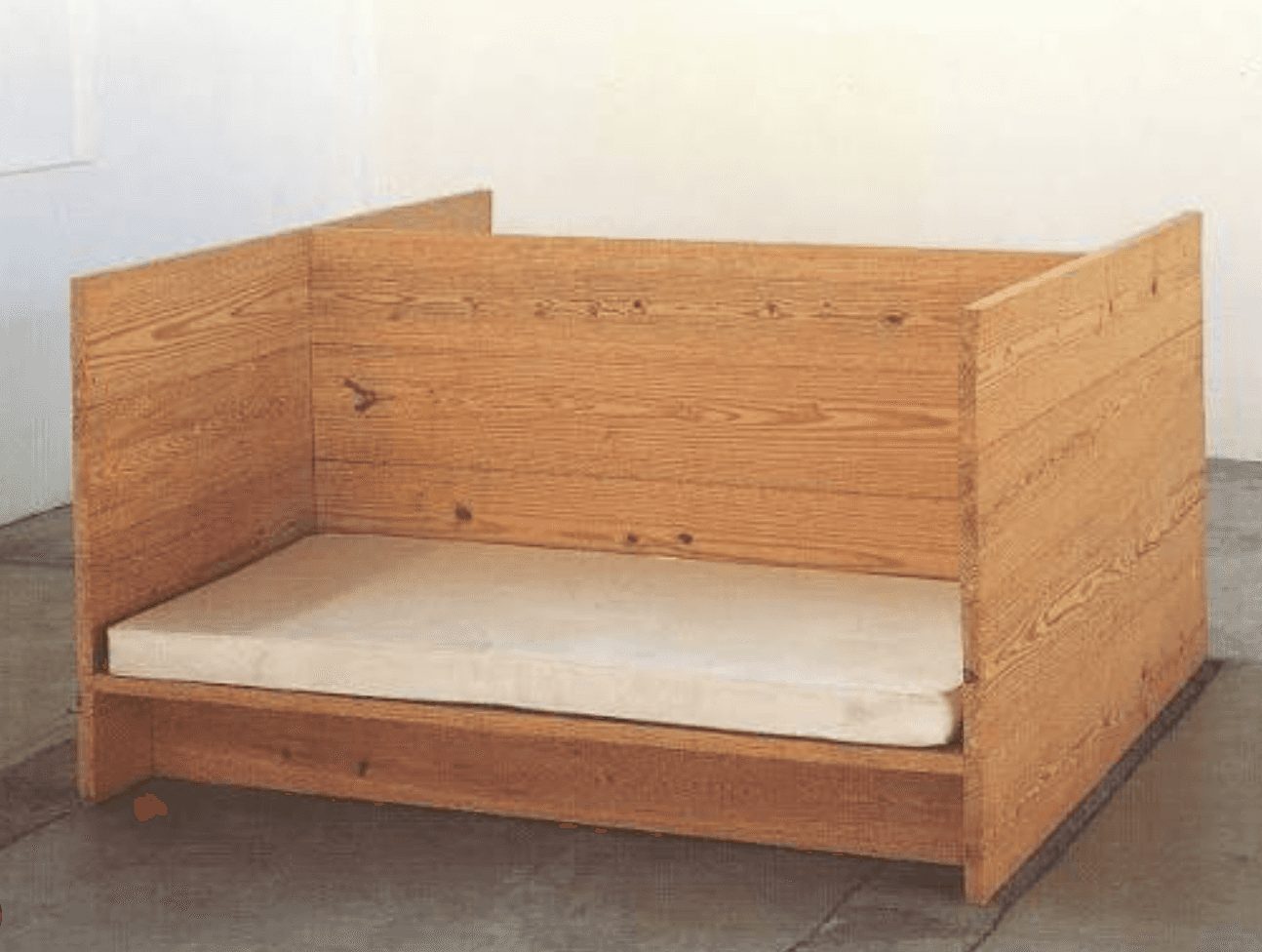 A minimalist bed frame crafted from light-toned wood, featuring high, solid panel sides and a lower… — free STL 3D model