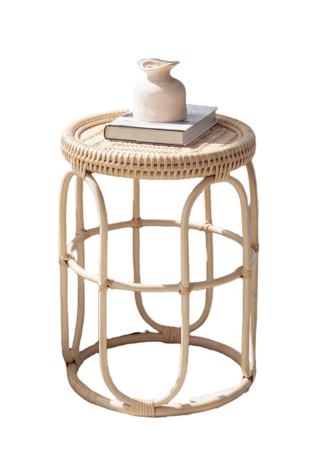 A light-colored, natural rattan stool featuring a round woven top and an open, cylindrical base constructed from bent rattan poles. The base consists of vertical arched segments joined by horizontal rings, forming a cage-like structure. The weaving on the top surface is tight and intricate, creating a smooth, flat sitting or resting surface, while the overall aesthetic is light and organic. — 3D model