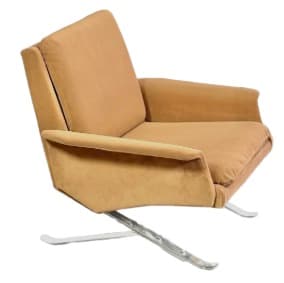 A modern upholstered lounge chair featuring a plush tan fabric and a distinctive, sculptural polished metal sled base. — 3D model
