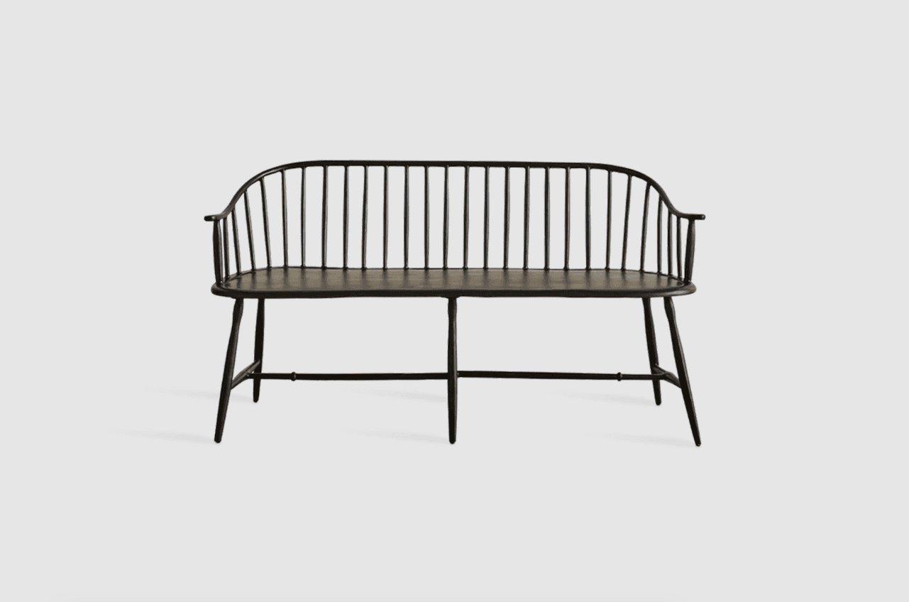 A black, slatted bench with a curved back and armrests. The bench features turned legs connected by stretchers, and the seat appears to be a solid panel. The design is reminiscent of Windsor-style furniture. — 3D model