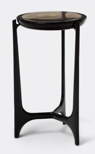 A tall, slender accent table featuring a round top with a dark, textured surface and a glossy black tripod base with sculptural, curved legs. — 3D model