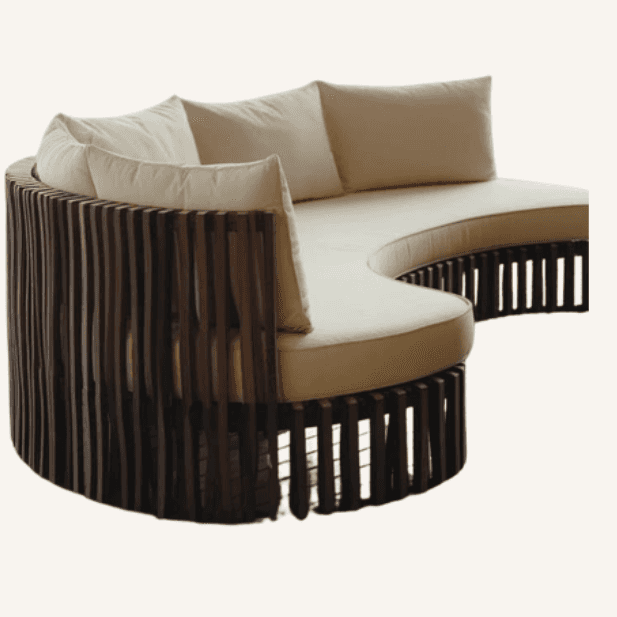 A large, crescent-shaped daybed featuring a dark slatted wooden frame and light-colored, plush uphol… — 3D model