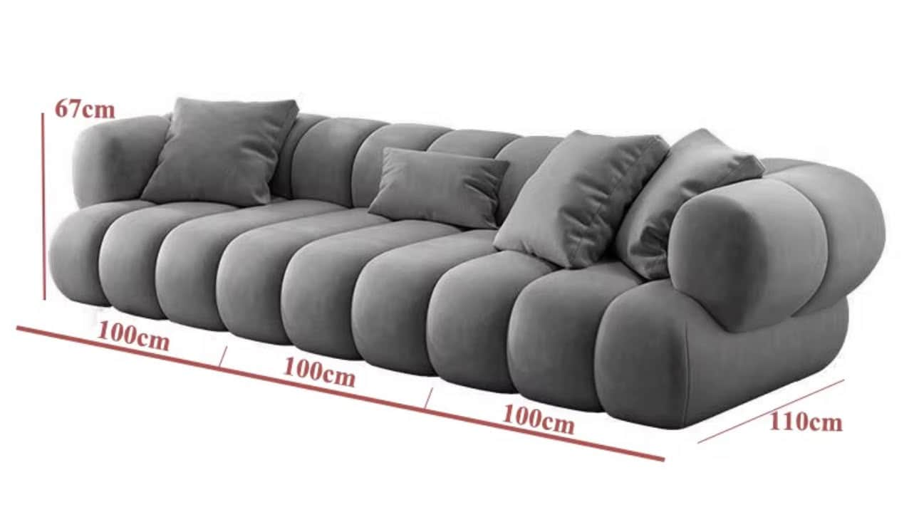 A long, contemporary sofa in a soft grey color, characterized by its distinctive 'bubble' or 'cloud-… — 3D model