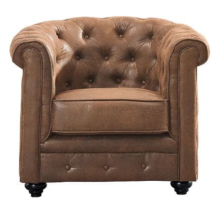 A classic Chesterfield-style armchair upholstered in a distressed brown faux-leather material, featuring deep button tufting on the backrest and rolled arms. It has a separate seat cushion with piping and rests on short, dark bun feet. — 3D model