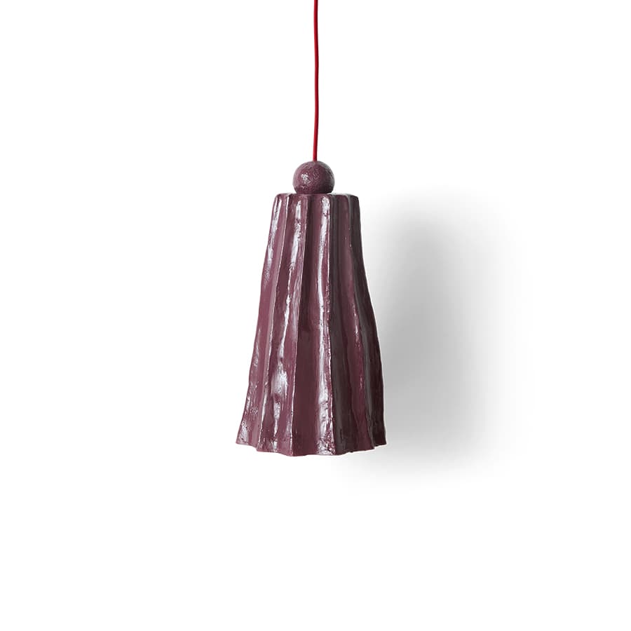 A dark purplish-plum pendant light with a distinct, irregularly pleated or fluted ceramic shade, suspended by a bright red textile cord. The shade is wider at the bottom and tapers slightly towards the top, where a small spherical finial integrates the fixture with the hanging cord. — 3D model