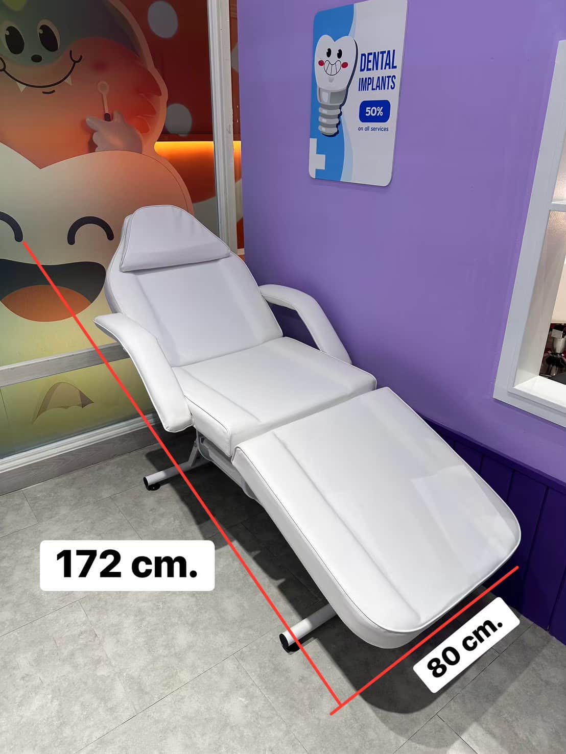 A white adjustable aesthetic treatment chair with a segmented, upholstered surface, metal frame, and… — 3D model