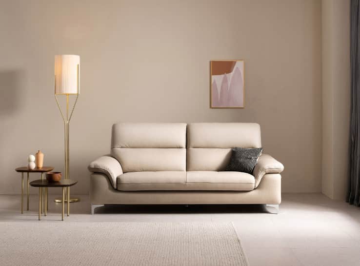 A light beige leather sofa with two seat cushions and a tufted seat base. It features a contemporary… — free OBJ 3D model
