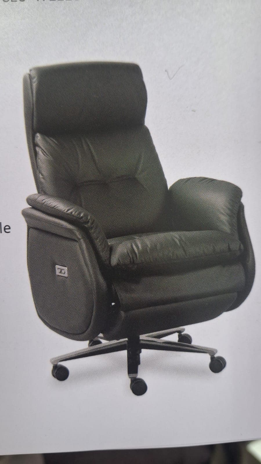A contemporary dark gray power recliner chair featuring plush, segmented cushioning upholstered in what appears to be leather or high-quality faux leather. It has a high back with an integrated headrest, padded armrests, and a five-star chrome-finished swivel base with casters, suggesting both mobility and reclining functionality. A control panel for power recline is visible on the right side. — 3D model