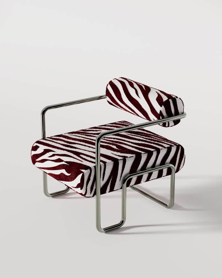 A striking lounge chair featuring a polished tubular steel frame and bold zebra-print upholstery in… — 3D model