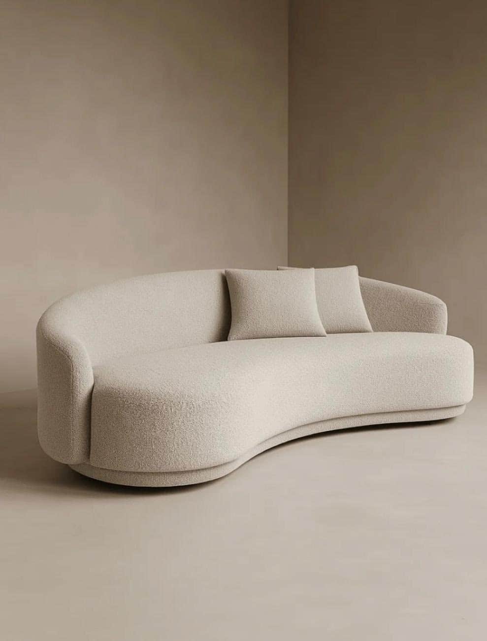 A contemporary, sculptural sofa featuring a deeply curved form, upholstered in a light beige boucle… — 3D model