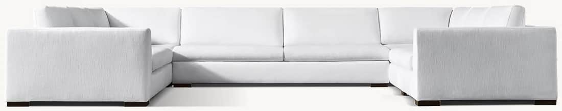 A large, white, sectional sofa with a U-shaped configuration. The sofa features a textured fabric up… — free GLTF 3D model
