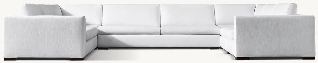 A large, white, sectional sofa with a U-shaped configuration. The sofa features a textured fabric upholstery, clean lines, and a low profile. It is supported by dark, square legs. — 3D model