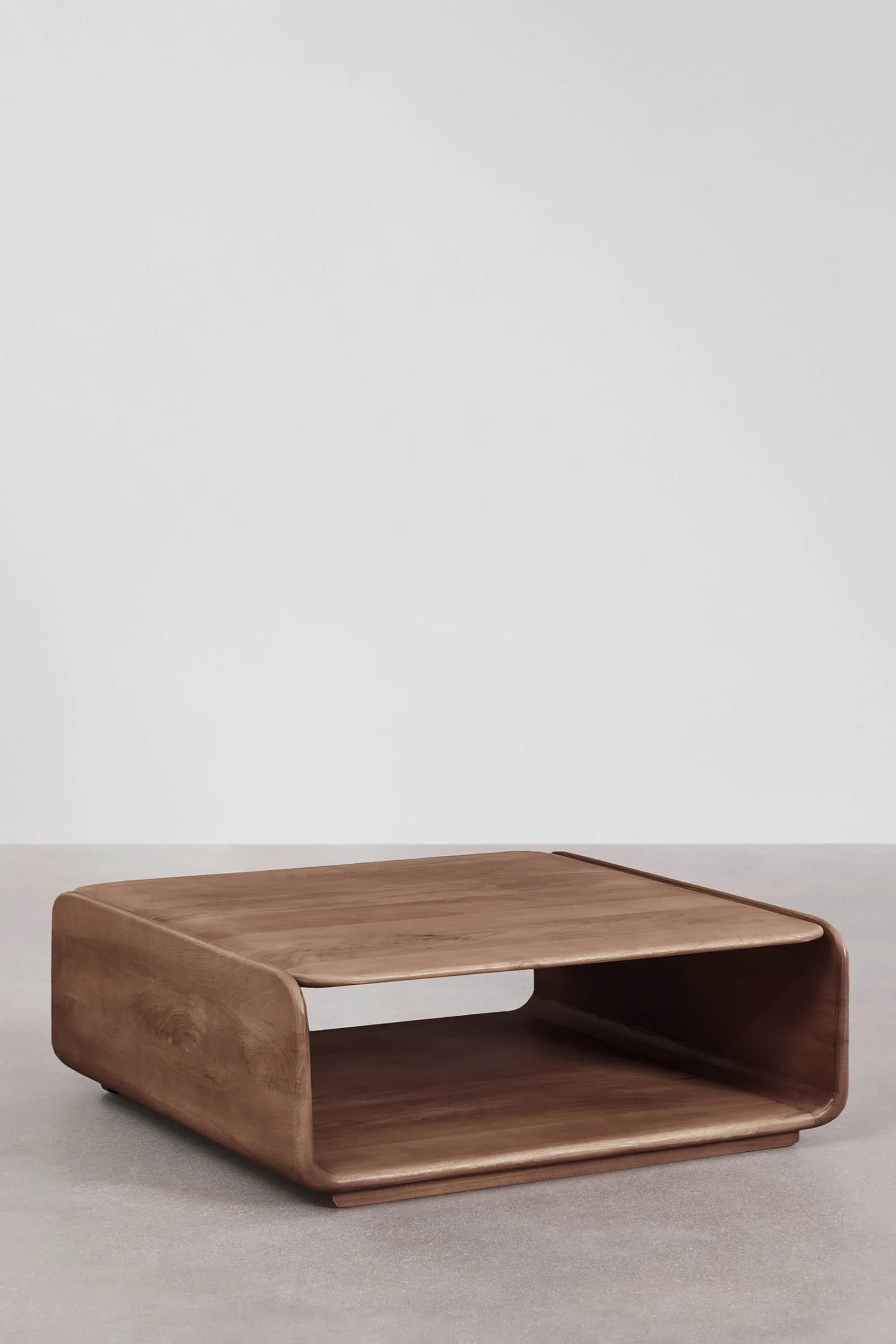 A rectangular coffee table made of medium-toned wood, featuring a curved, contemporary design with a… — free STL 3D model
