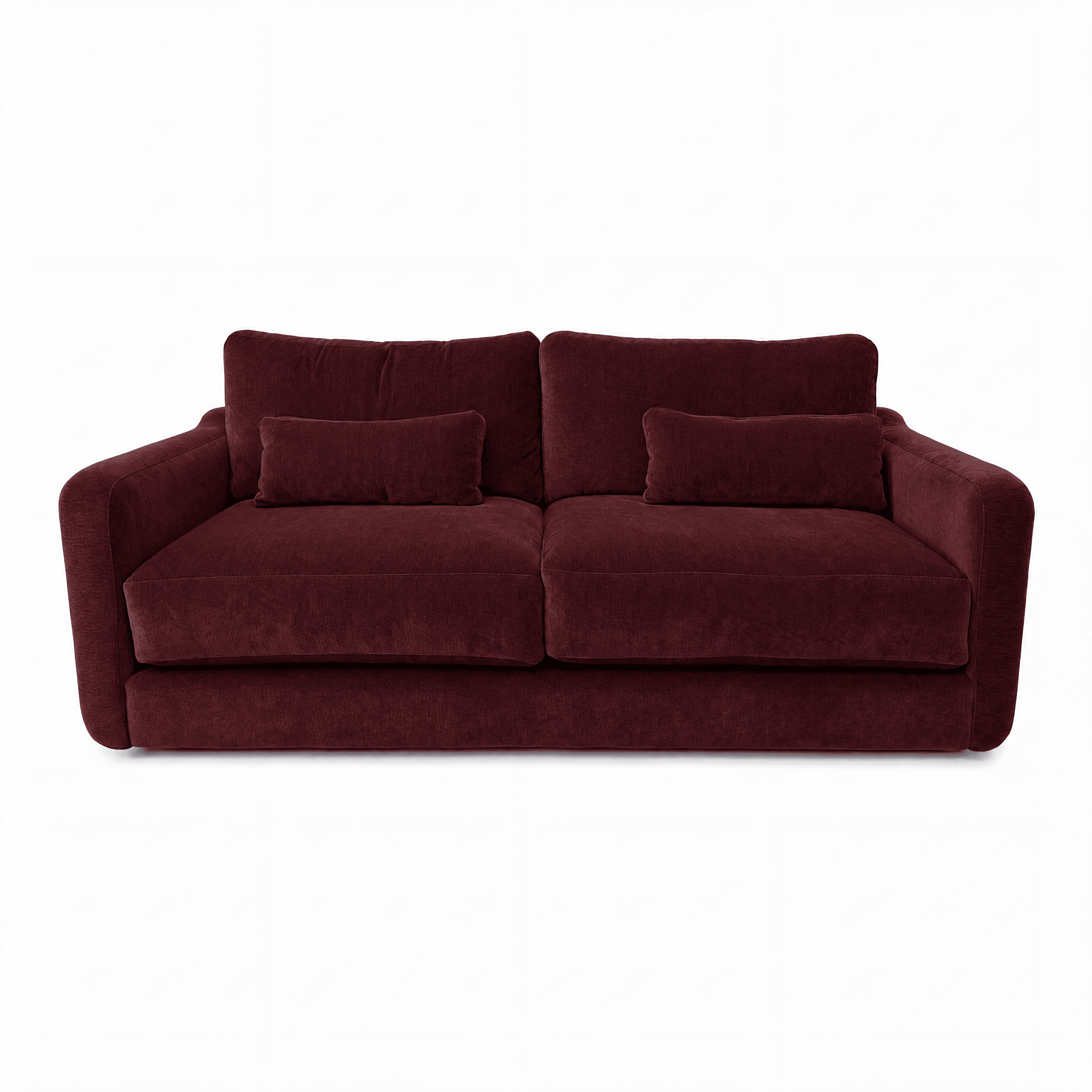 A two-seater sofa upholstered in a rich burgundy corduroy-like fabric. It features deep, plush seat cushions and two large back cushions, accompanied by two smaller rectangular bolster pillows. The arms are gently rounded and softly padded, and the sofa maintains a low profile with a continuous base that appears to rest directly on the floor. The overall aesthetic is comfortable and inviting, suitable for a contemporary or casual living space. — 3D model