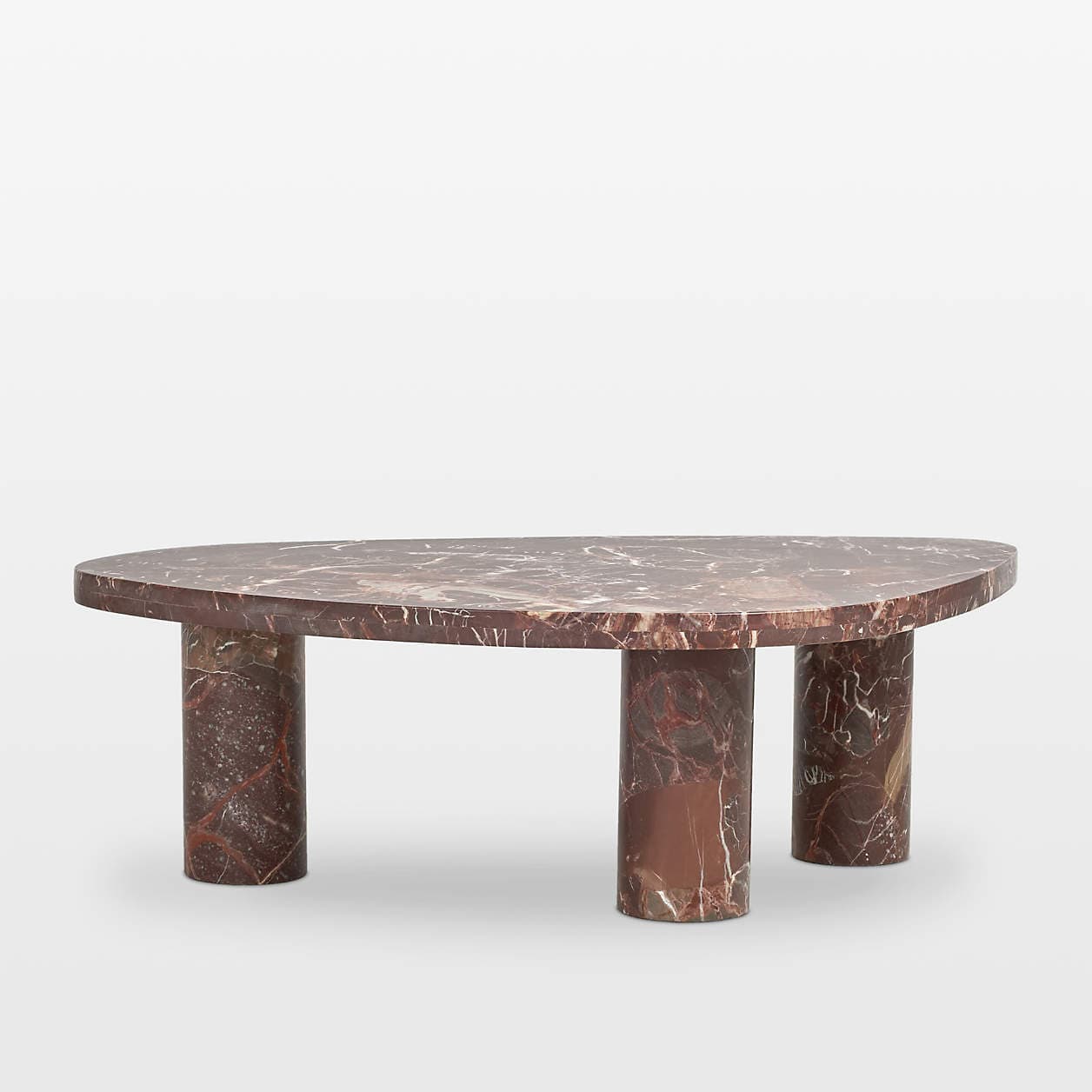 A contemporary coffee table with an abstract, asymmetrical top and three cylindrical legs. The table features a distinctive marble pattern in shades of deep red and white. — 3D model