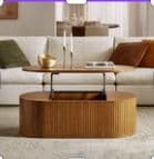 A modern, oval-shaped coffee table with a lift-top mechanism. The base is cylindrical and features vertical fluting, while the top is a solid, flat surface. The lift-top is supported by black metal brackets. — 3D model