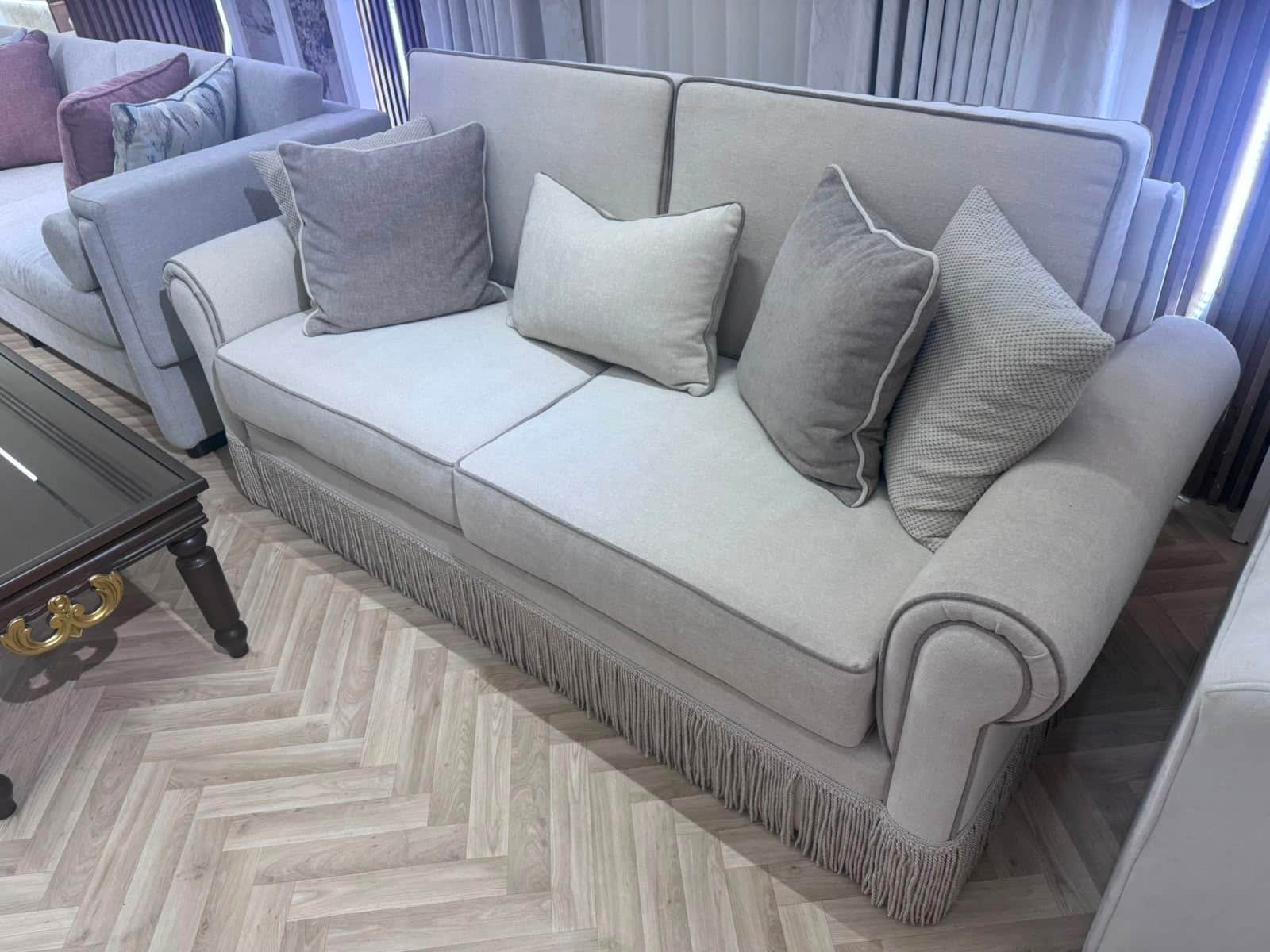 A two-seater upholstered sofa featuring rolled arms, a skirted base with fringe, and piped edges. Th… — 3D model