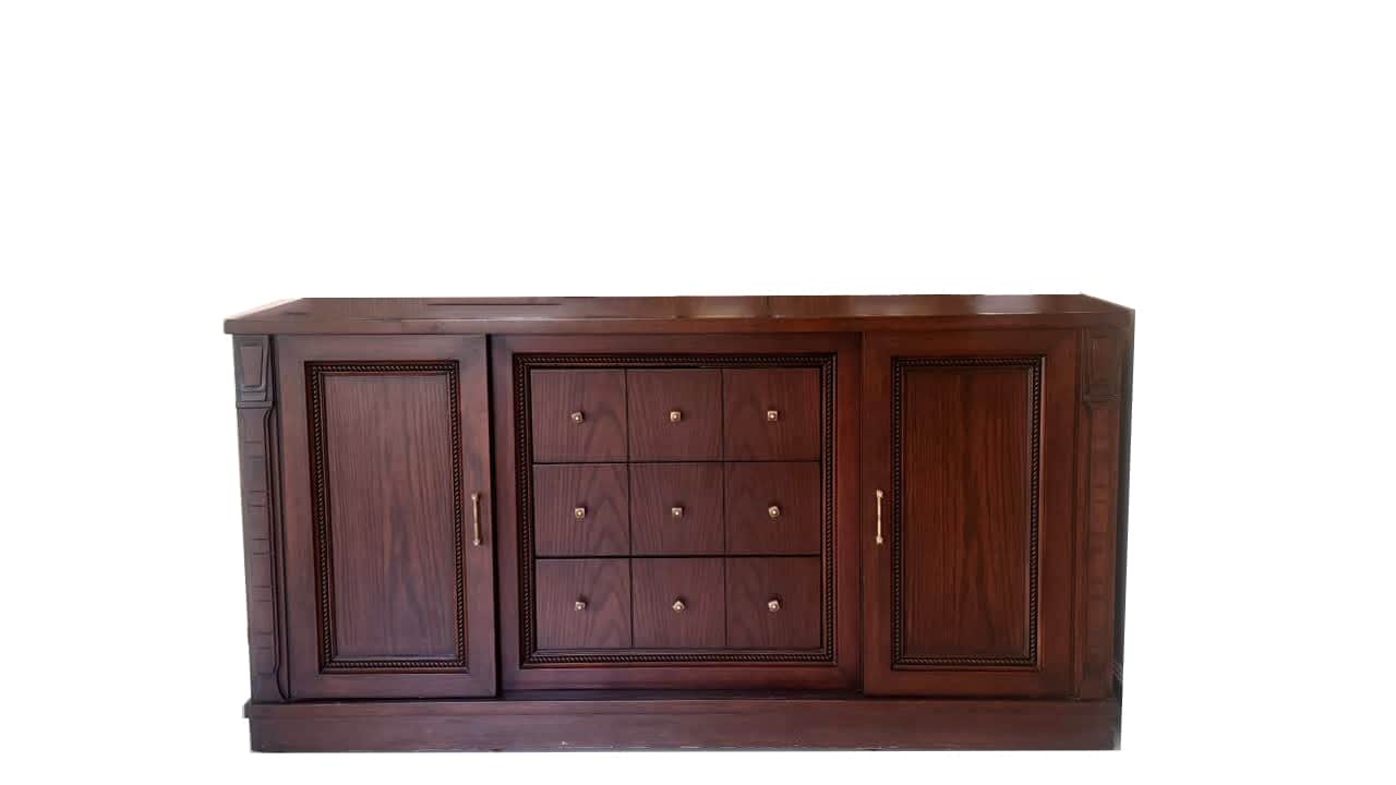 A traditional dark wood sideboard featuring two cabinet doors flanking a central section of nine sma… — free BLEND 3D model