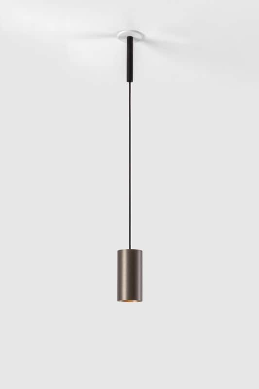 A modern cylindrical pendant light is suspended from a white ceiling canopy by a thin black cord. Th… — 3D model