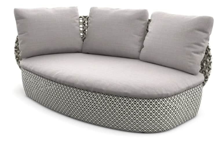A contemporary curved outdoor sofa featuring a woven base and backrest with a geometric pattern, top… — 3D model