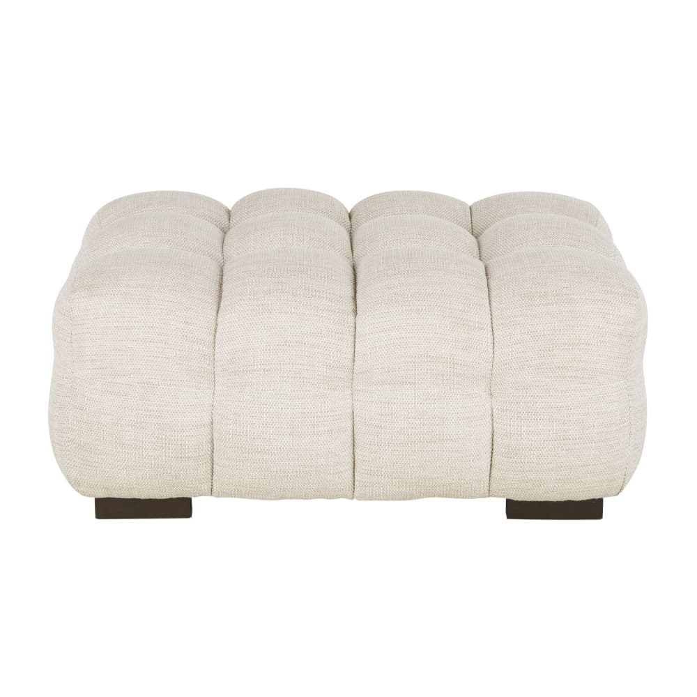 A rectangular, tufted ottoman with a textured cream-colored upholstery. The tufting creates a series of deep, parallel channels across the top surface. It rests on two low, dark brown rectangular bases that are set inwards from the sides. — 3D model