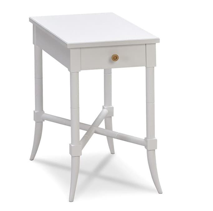 A tall, narrow white end table with a single drawer and decorative cross bracing between the legs. The table has a slightly slanted top and appears to be made of wood. The legs are styled to resemble bamboo segments with square joinery details. A small, round brass knob is centered on the drawer. — 3D model