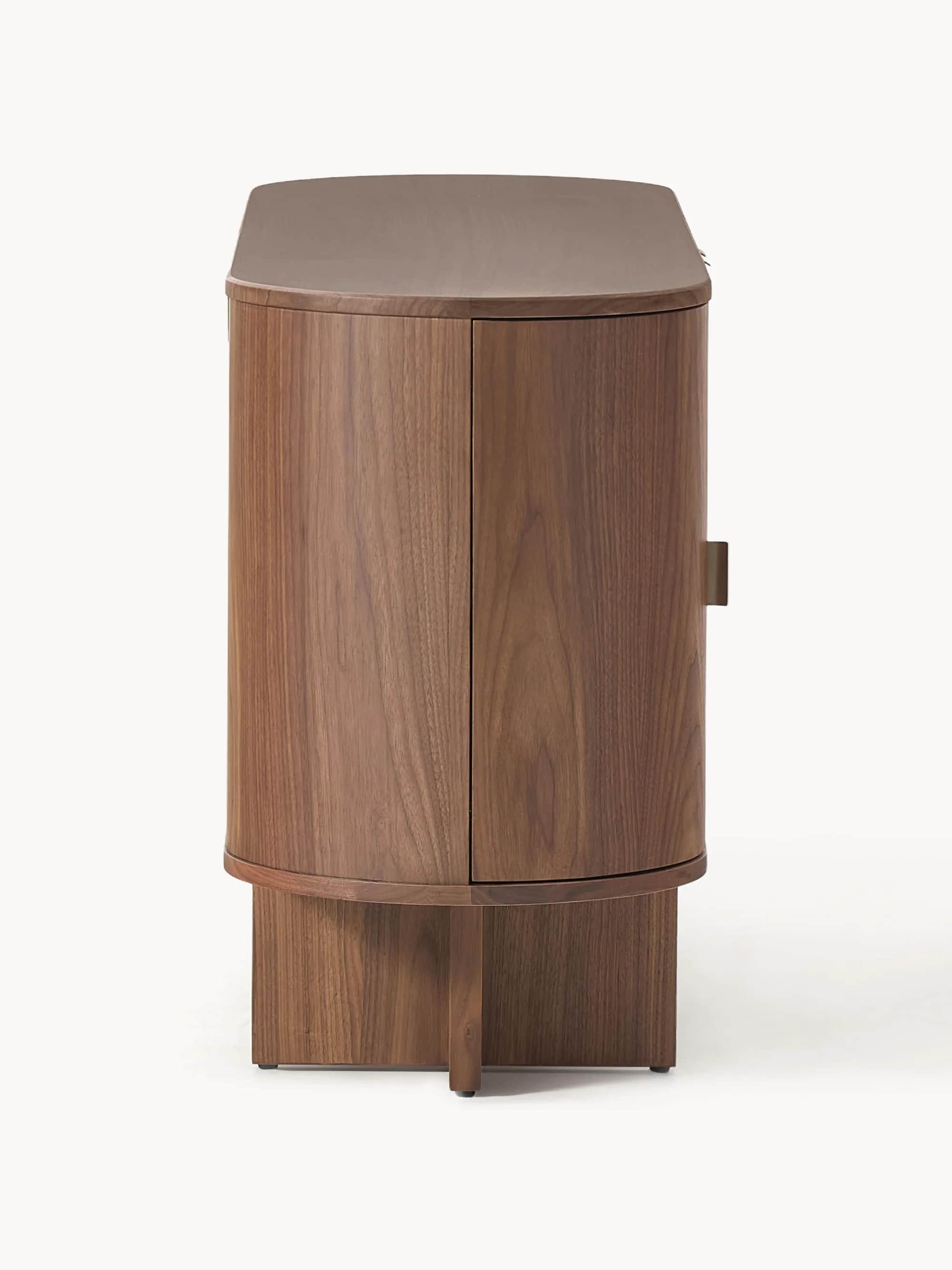 A mid-century modern inspired cabinet with a rounded, cylindrical body and a plinth base. It feature… — 3D model