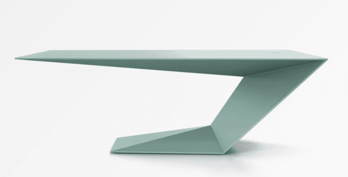 A modern desk with a striking, geometric design. The desk features a thin, cantilevered tabletop that appears to float, supported by a single, angular leg structure. The leg is constructed from folded planes creating a dynamic, sculptural form. There is a small, circular opening on the tabletop, possibly for cable management. — 3D model
