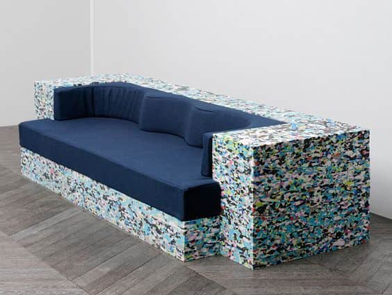 A modular sofa with a distinct construction. The base and armrests are composed of compressed, multi… — free GLTF 3D model