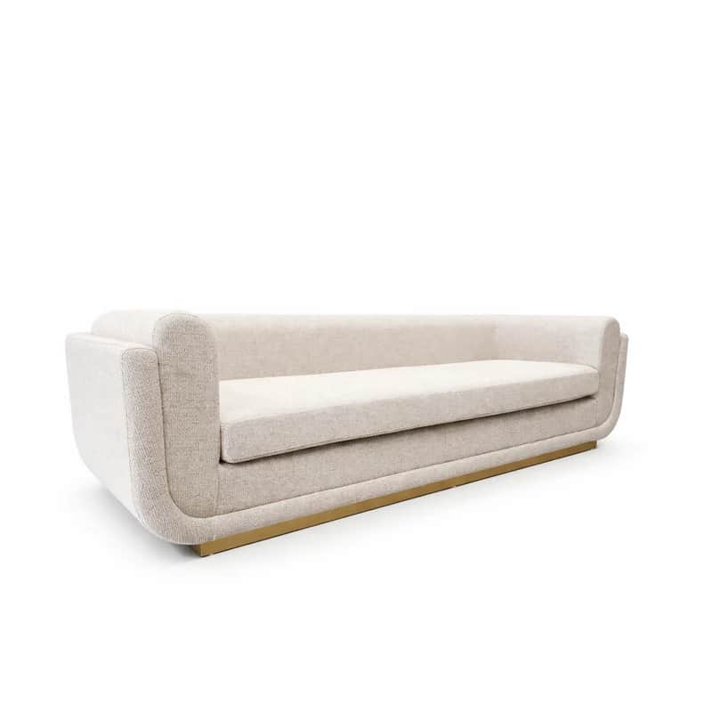 A modern sofa featuring a curved, fully upholstered frame and a distinctive brass-finished plinth ba… — free STL 3D model