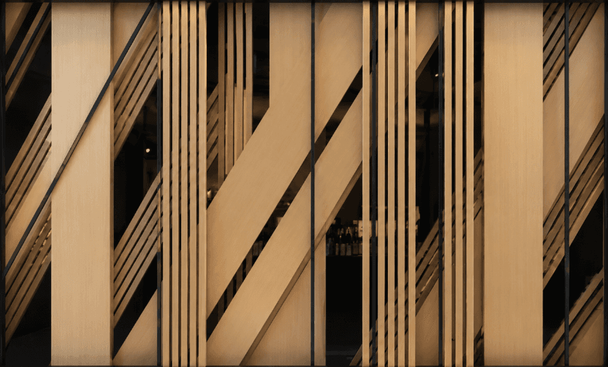 An abstract room divider or partition screen featuring an intricate geometric pattern of light-toned wooden slats and panels. The wooden elements are arranged vertically and diagonally, creating an dynamic visual effect. Thin, black vertical elements are interspersed throughout, adding contrast and definition to the design. The overall appearance is clean, modern, and suggests a contemporary aesthetic. — 3D model