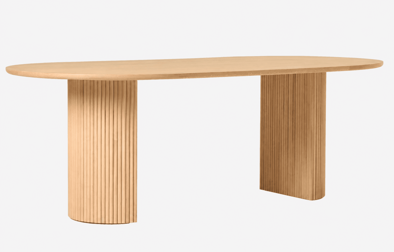 A contemporary light-toned wood table featuring an elongated oval or racetrack-shaped top supported by two substantial semi-cylindrical pedestal bases with vertical fluting. — 3D model