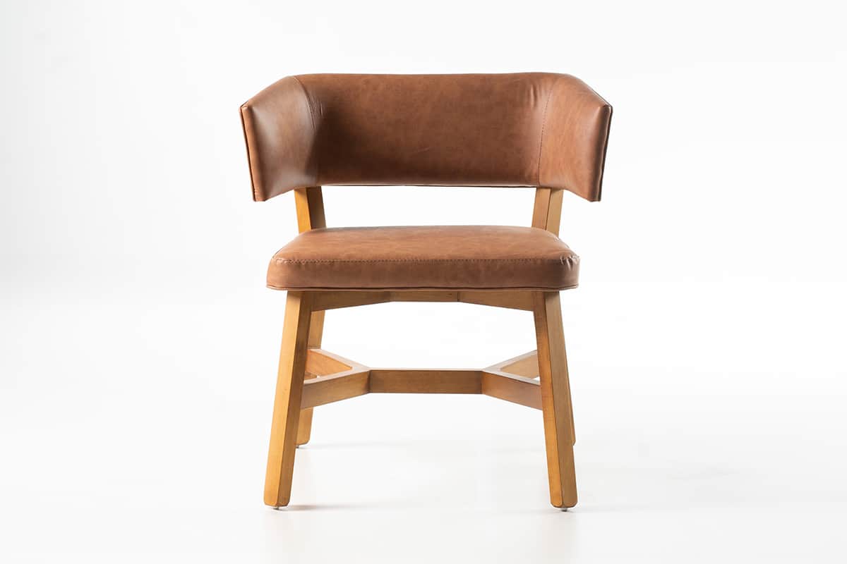 A brown upholstered chair with a light-colored wooden frame, featuring a curved backrest that subtly… — free BLEND 3D model