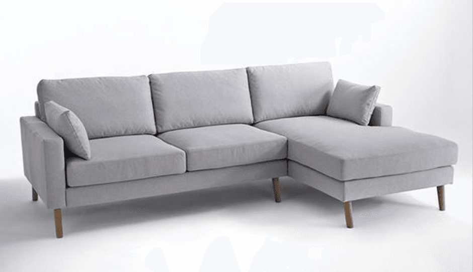 A contemporary sectional sofa upholstered in light grey fabric, featuring a three-seat main section and a right-hand facing chaise lounge. It has clean lines, track arms, loose back and seat cushions, and is supported by four tapered wooden legs. — 3D model
