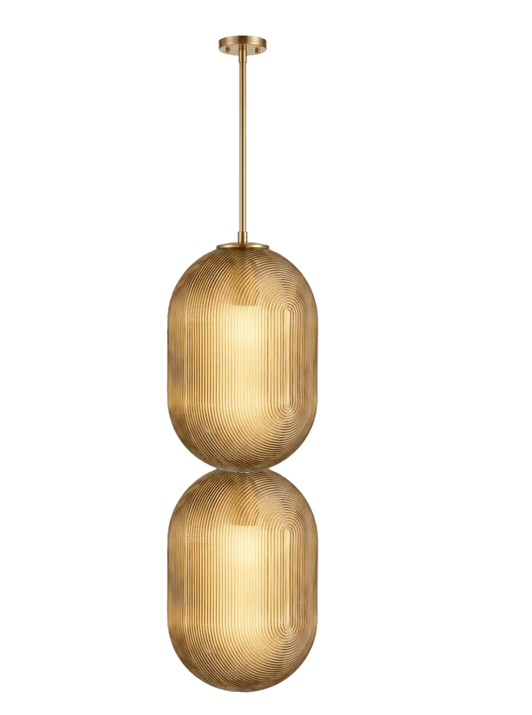 A contemporary pendant light featuring two vertically stacked, elongated capsule-shaped shades made of fluted amber-toned glass, suspended by a slender brass rod from a round ceiling canopy. The fluting on the glass shades creates a distinct, rhythmic pattern that reflects light, enhancing the texture and depth. When illuminated, the light source within each shade casts a warm, diffused glow through the textured glass. — 3D model