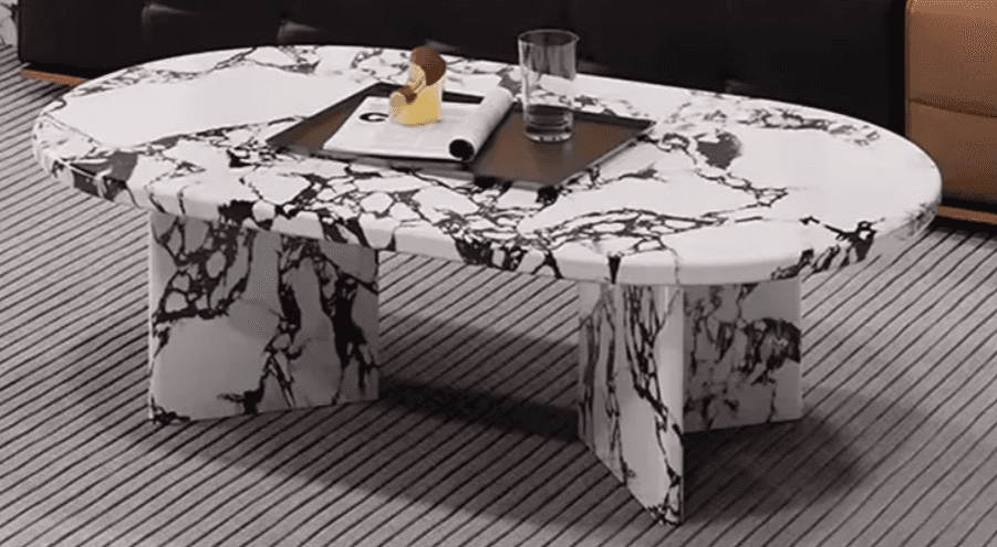 An oval-shaped coffee table with a marble-patterned top and base. The base consists of two block-lik… — 3D model