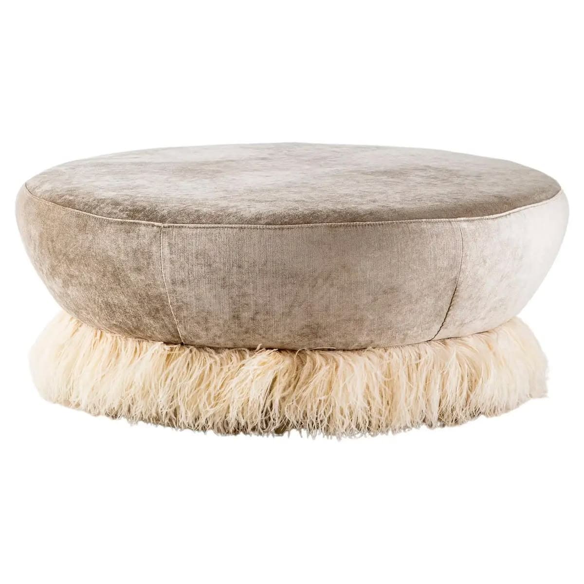 A round ottoman with a plush, velvety texture on its upper surface and sides. The base of the ottoman is adorned with a thick fringe of shaggy, cream-colored material, possibly faux fur or natural fibers. The overall form is bulbous and inviting, with a distinct separation between the upholstered top and the fringed base. — 3D model