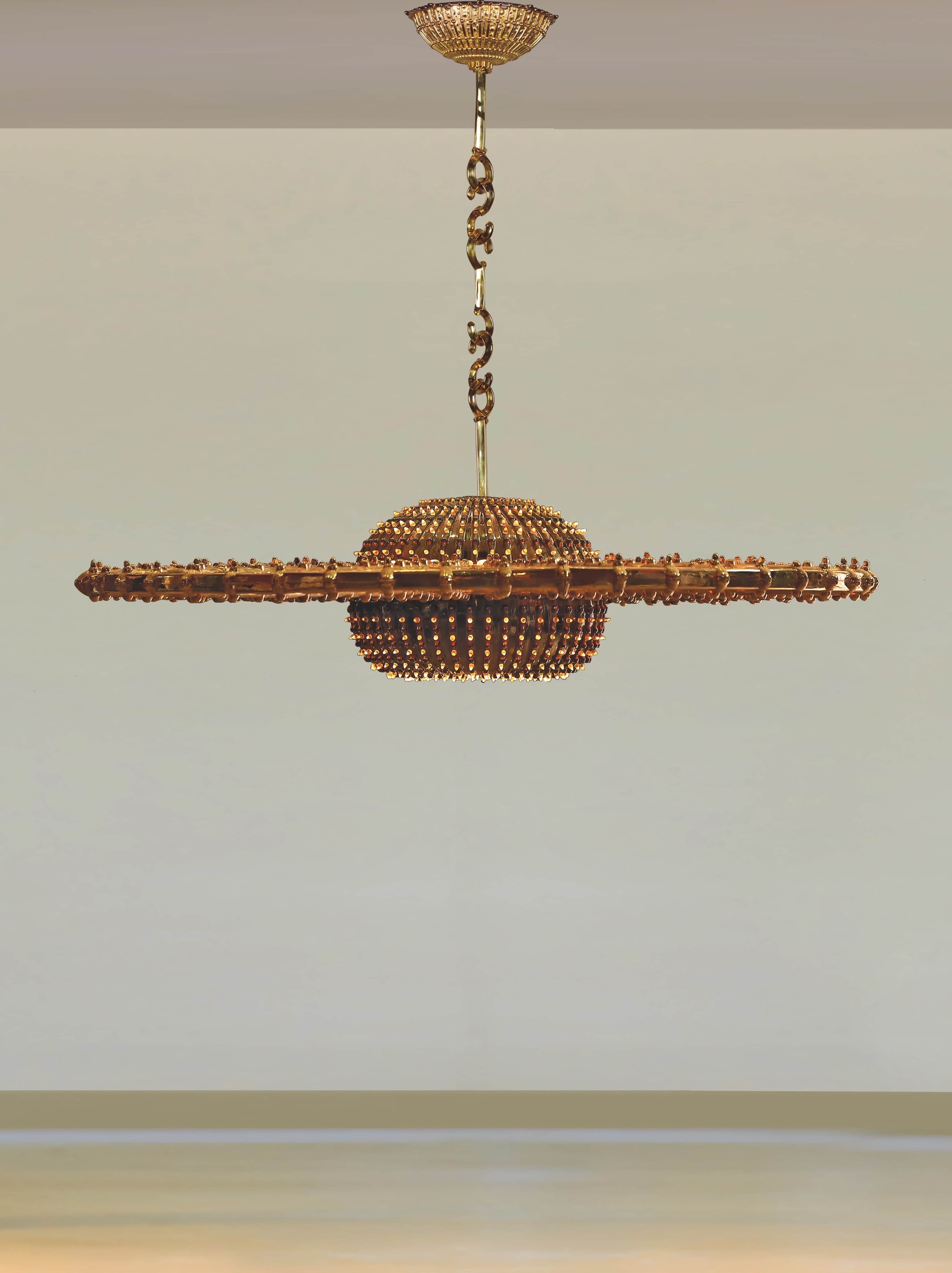 A highly ornate ceiling-mounted chandelier featuring a gold-toned metal construction. It consists of… — 3D model