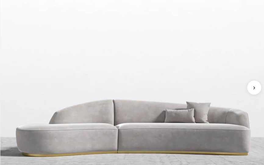 A contemporary curved modular sofa upholstered in light gray velvet, featuring an integrated backres… — free GLTF 3D model