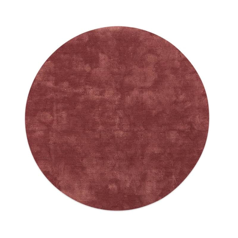 A circular rug with a short pile and a uniform, slightly textured surface. The color is a deep, mute… — 3D model