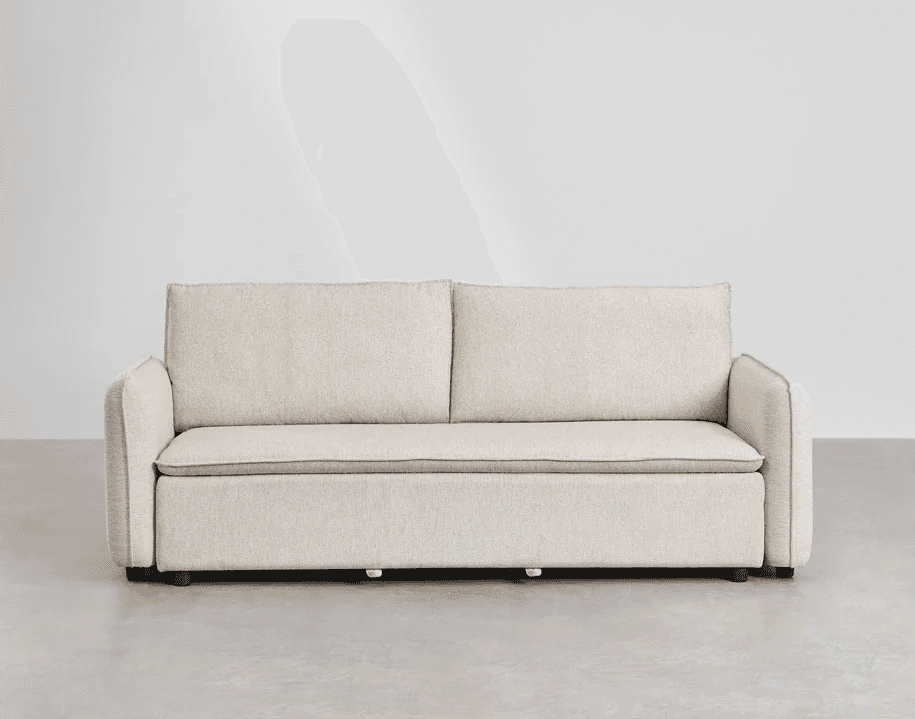 A contemporary three-seater sofa with a neutral-toned upholstered finish. The sofa features two back cushions and a seat cushion, with subtle piping along the edges of the cushions and armrests. The armrests are moderately wide and slightly curved inwards. The base of the sofa is low-profile with visible dark-colored legs. — 3D model