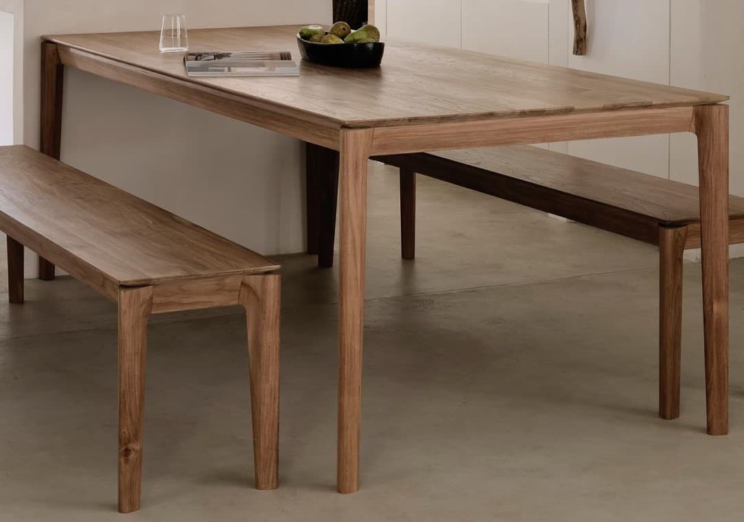 A rectangular dining table with four tapered legs. The tabletop has a visible wood grain pattern, and the legs are integrated into the frame of the tabletop. The design is minimalist and modern. — 3D model