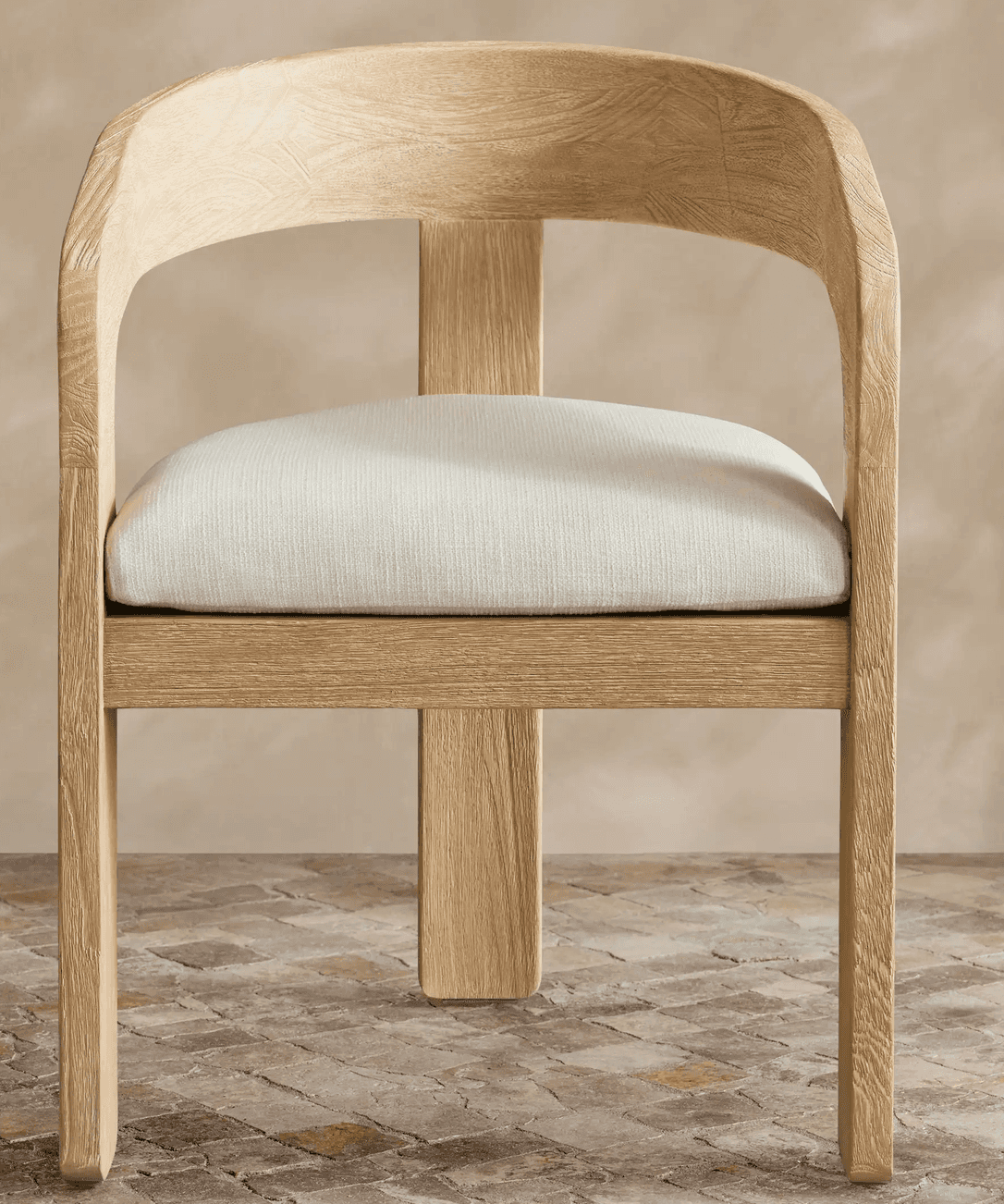 A contemporary dining armchair featuring a solid wood frame with a light, natural finish and visible… — 3D model