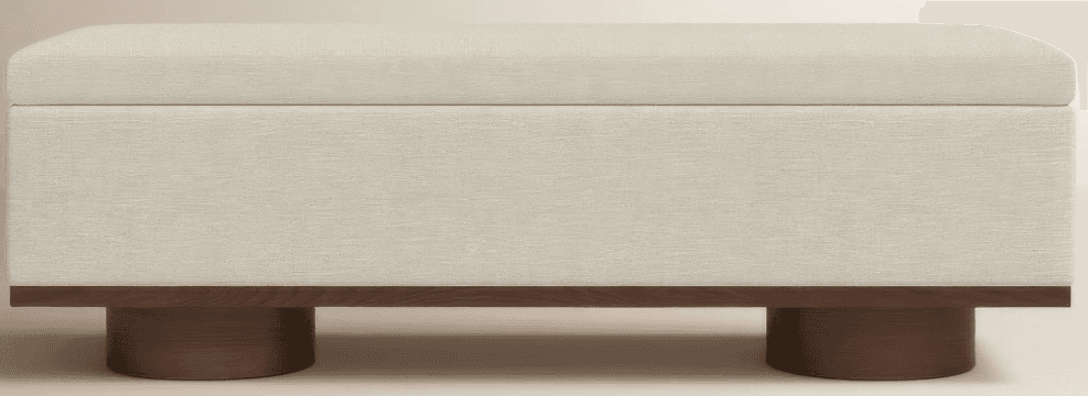 A rectangular ottoman with a padded, upholstered top and a wood base. The base features a horizontal wooden plank and two cylindrical wooden legs. The upholstery appears to be a textured fabric. — 3D model