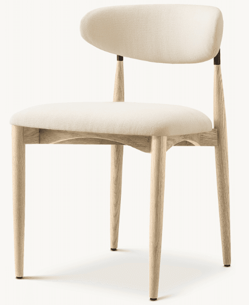 A modern dining chair with a subtly curved backrest and a padded seat. The frame and legs are constructed from light-colored wood with visible grain, and the upholstery is a textured, off-white fabric. The design features tapered legs and minimalist structural supports. — 3D model