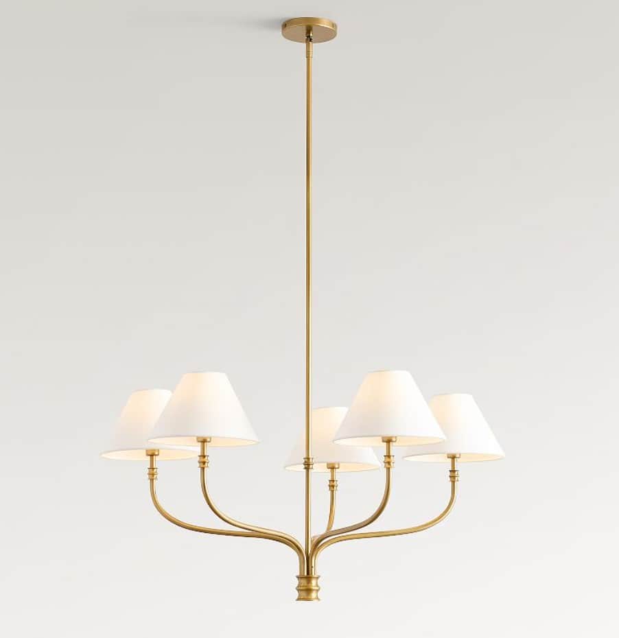 A brass chandelier with five arms, each supporting a white conical lampshade. The central stem exten… — 3D model
