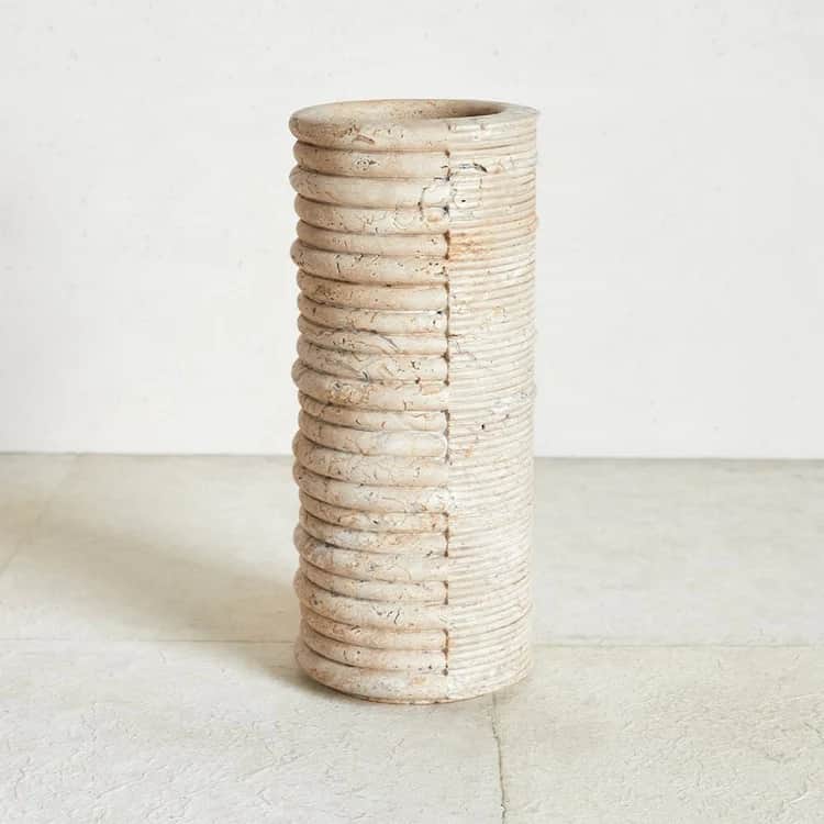 A large, cylindrical decorative vase featuring a distinctive two-tone, two-texture design. One half… — 3D model