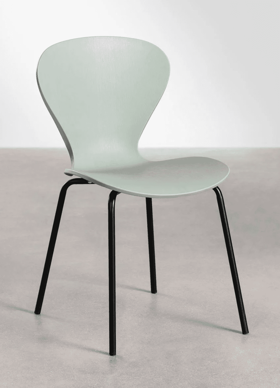 A modern dining chair with a molded shell seat and back, supported by a black metal four-leg base. T… — 3D model